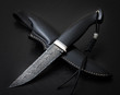 Hunting knife from Damascus mosaic  on a black background. Leather Sheath Handmade