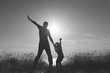 © ruslanshug - happy father and son playing on sunset sea in summer black and white vintage