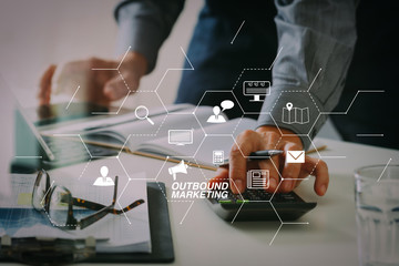 Poster - businessman hand working with finances about cost and calculator and latop with mobile phone on withe desk in modern office