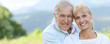Portrait of cheerful senior couple embracing each other, template