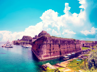 Wall Mural - charming landscape with the old fortress and canal with boats in kerkira (kepcipa), corfu, greece. t