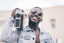 African Man With Vintage Radio Device.