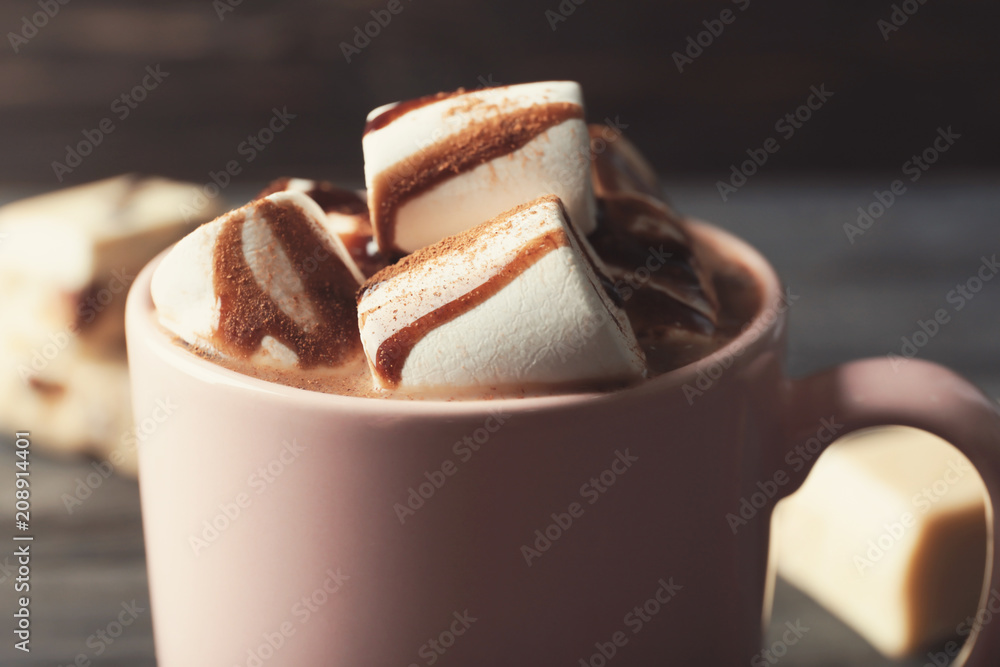 Cup of tasty cocoa drink  with marshmallow, closeup