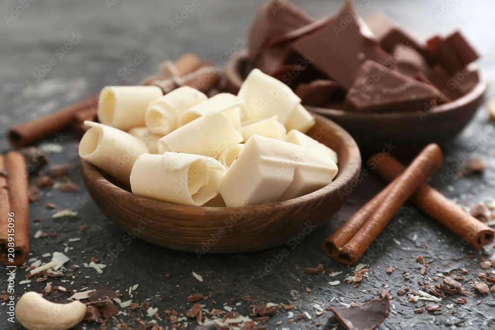Bowl with tasty chocolate on table