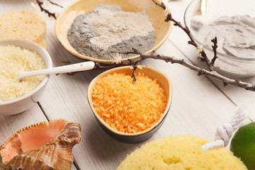 Wall Mural - orange sea salt and face cream on white wood