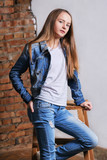 Cheerful Young Woman in Casual Outfit, in White Tank Top, Jeans and Black  Jacket, Posing in Studio, Looking at the Camera Stock Image - Image of  model, casual: 286147915