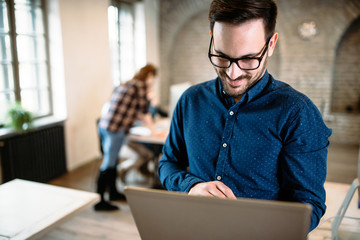 young architect working on computer in office