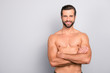 © deagreez - Portrait with copy space of attractive, virile, harsh, sporty, manly, stunning man with crossed arms, muscular, naked torso, looking at camera, isolated on gray background