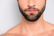Wellness, wellbeing concept - close up cropped half face portrait  of virile, harsh, manly, attractive, naked, unrazored, handsome, stunning man with ideal, perfect skin isolated on gray background