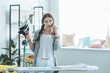 © LIGHTFIELD STUDIOS - beautiful teen girl talking on smartphone while ironing at home