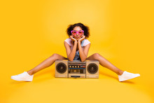 Portrait Of Sexy Charming Girlfriend In Eyewear Having Boom Box Sending Kiss With Pout Lips At Camera Isolated On Yellow Background. Leisure Rest Relax Concept