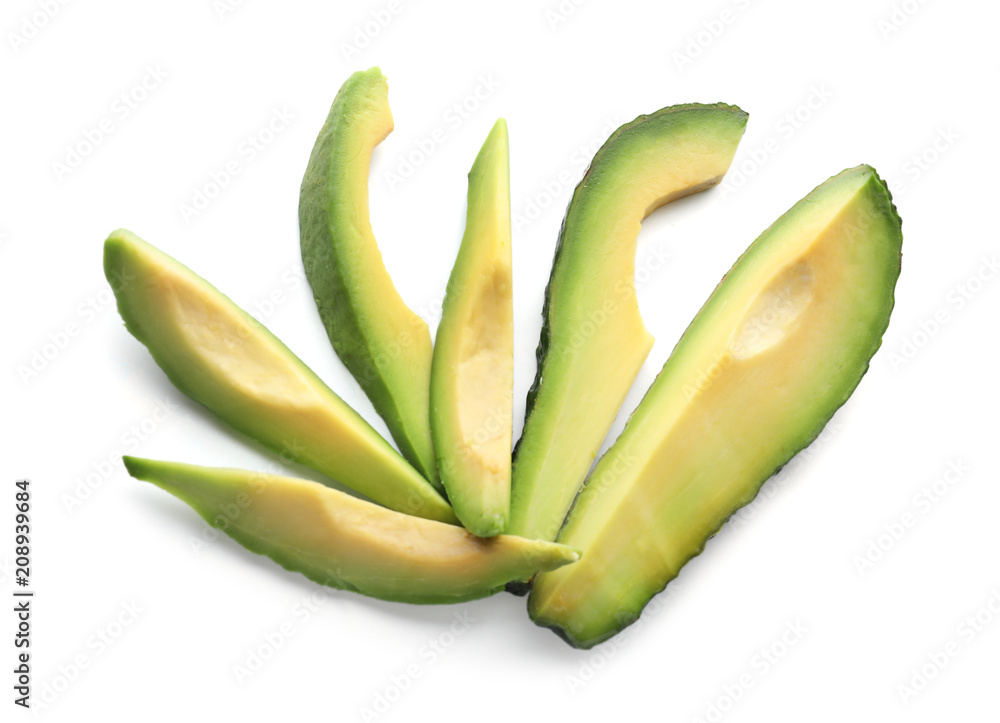 Slices of ripe avocado on white background