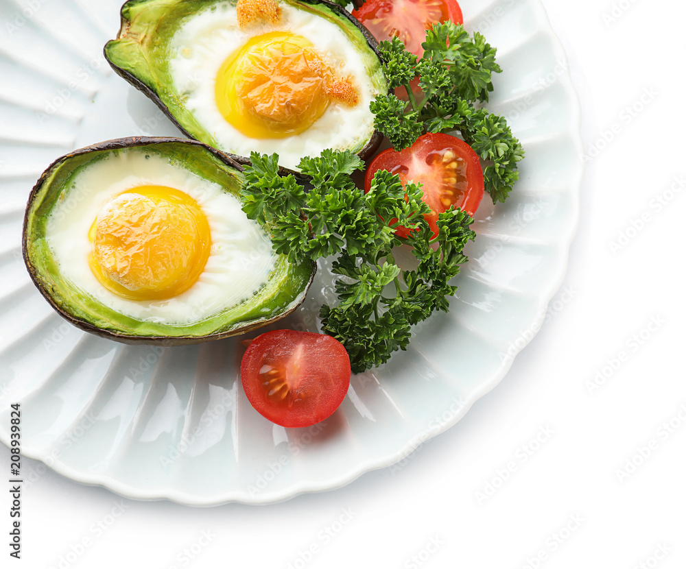 Baked avocado with eggs on white background