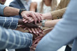 © ASDF - Close-Up of hands business team showing unity with putting their hands together