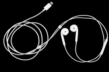 earphones on black background.