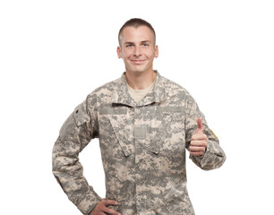 Wall Mural - Smiling Soldier Giving the Thumbs Up On White Studio Background