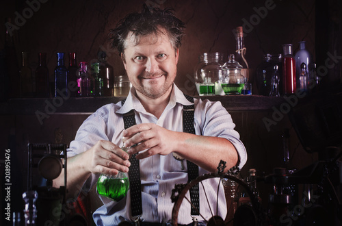 medieval scientist reading book in his laboratory Poster