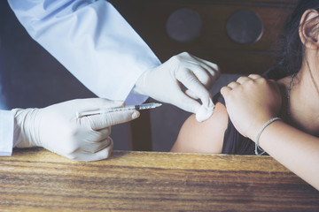 Selective focus,Doctor inject vaccine to patient.