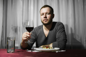 Man holding a glass of wine