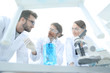 © ASDF - Group of scientists working on an experiment at the laboratory