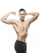 © Vladimir - beautiful bodybuilder shows bicep on white background
