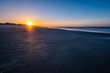 golden sunrise on a sandy beach in north Carolina in Holden Beach