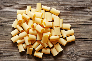 Big italian pasta on a wood rustic background