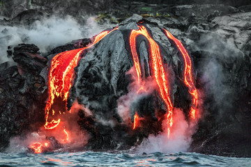 hawaii lava flow entering the ocean on big island from kilauea volcano. volcanic eruption fissure vi