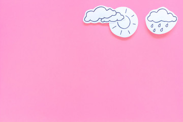 Wall Mural - rainfall forecast concept. weather icons. rainy cloud, lightening on pink background top view copy s