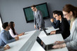 © NDABCREATIVITY - Business colleagues in conference room
