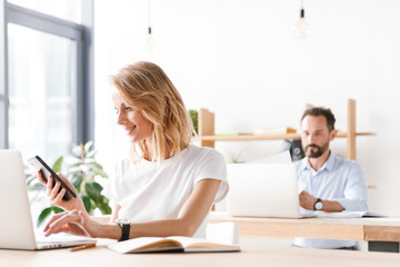 Wall Mural - Smiling woman manager working with laptop computer