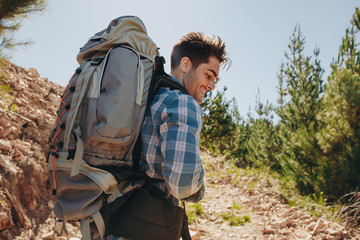 Wall Mural - male hiker trekking on mountain