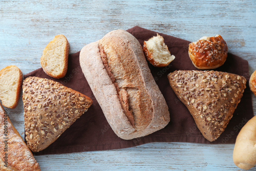 Different bakery products on wooden background