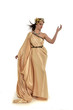 © faestock - full length portrait of brunette woman wearing long golden grecian gown. standing pose on white studio background.