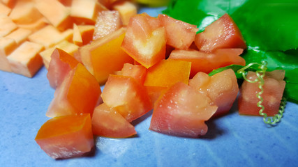 fresh cut tomato in vegetable plate