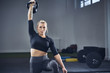 © Westend61 - Woman doing kettlebell exercise at gym