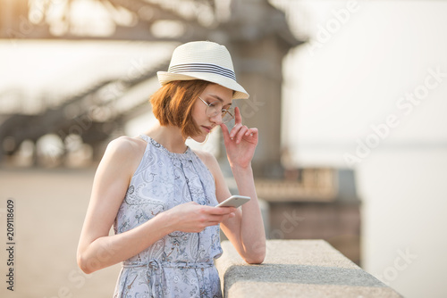 Close Up Of A Smiling Attractive Girl With Short Hair Talking On A