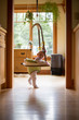 © bluemountainthyme/Stocksy - A baby plays in her jumper