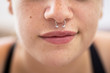 © ACALU/Stocksy - Close up of woman with nose ring