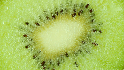 Macro of kiwi fruit in soda water