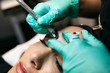 © Sean Locke/Stocksy - Spa: Female Undergoes Microblading Treatment Permanent Makeup
