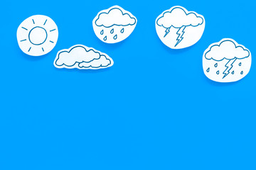 Wall Mural - modern weather icons set on blue background top view copy space