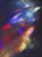 Colorful Light From Stained Glass On The Floor Of A Church