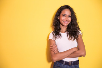 pretty asian girl smiling with arm crossed