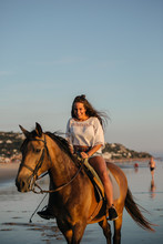 Teen Riding Horse At The Beach