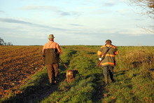 Department of Aisne. Big game hunting season (autumn). Hunters walking to the monitoring site.