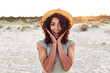 © Drobot Dean - Close up of excited young african girl in summer hat