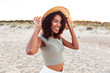 © Drobot Dean - Close up of smiling young african girl in summer hat