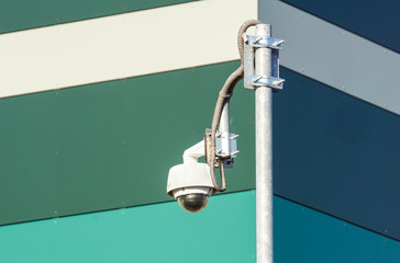 video camera security system on the wall of the building