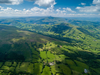 Wall Mural - aerial view of green farmland and fields in the rural welsh countryside